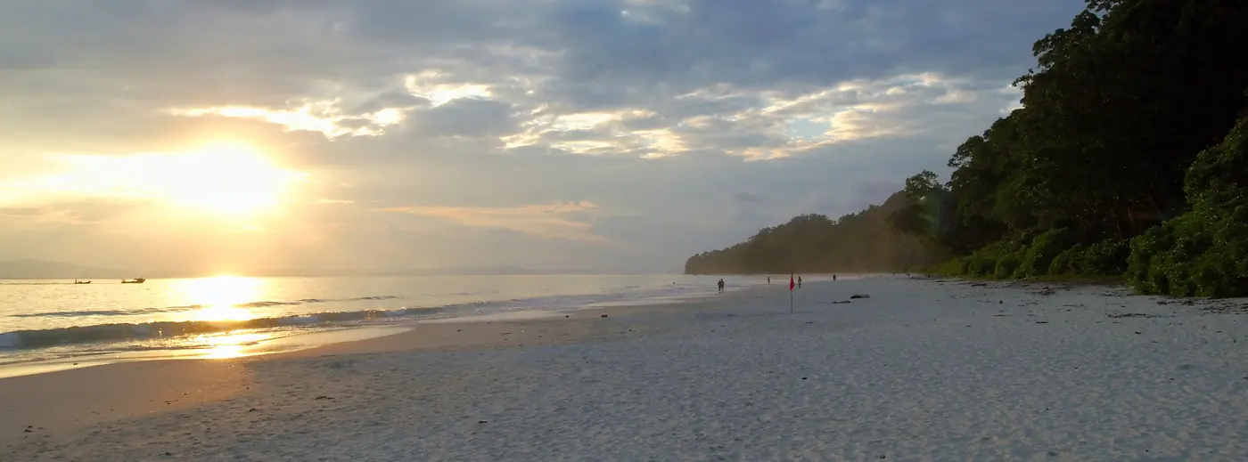 Sunset over a calm beach on Havelock Island